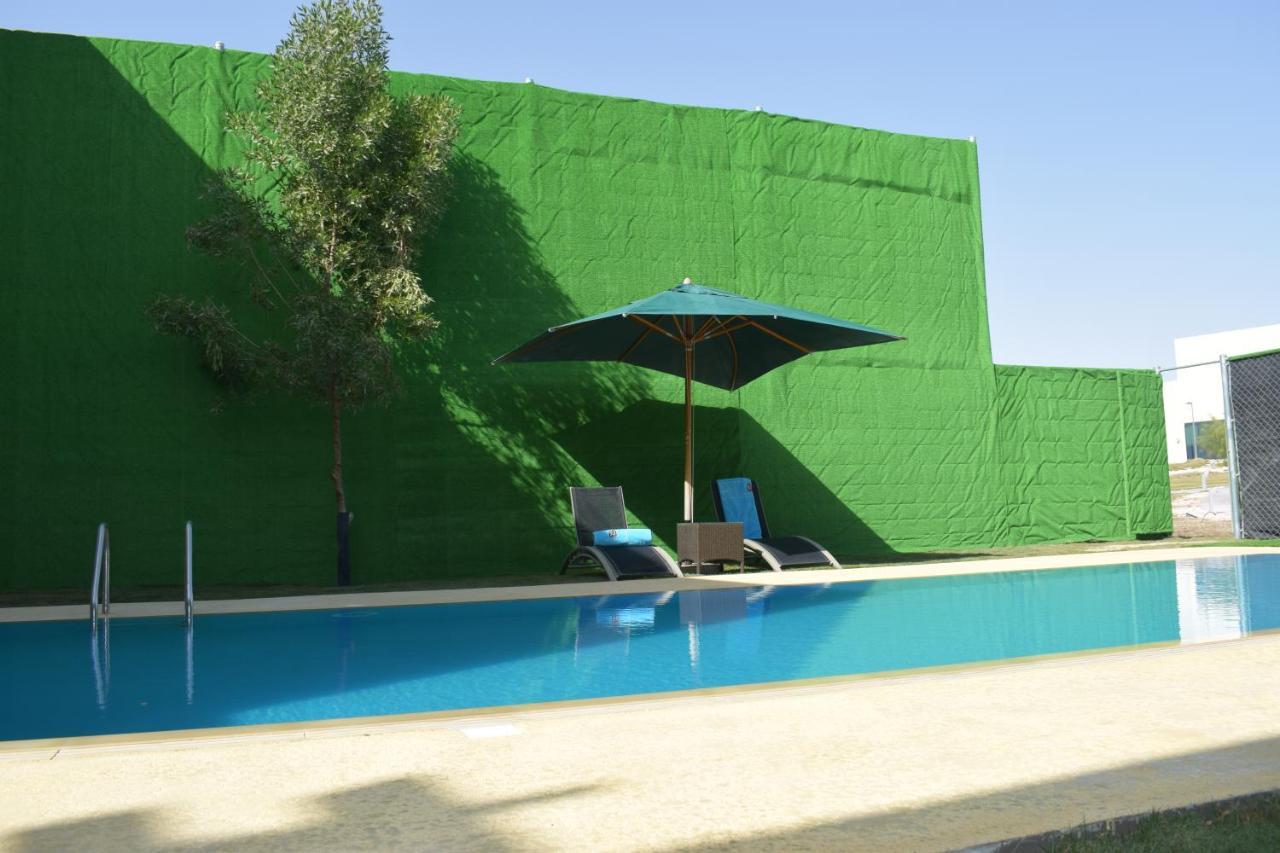 Retaj Salwa Resort & Spa Al Rayyan Dış mekan fotoğraf A swimming pool in Spain
